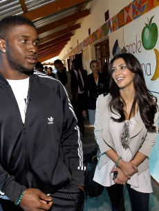 Kim Kardashian and boyfriend Reggie Bush pay a visit to the Motswedi Rehabilitation Centre during a Diamond Empowerment Fund tour of Africa in Mochudi, Botswana on July 14, 2009 