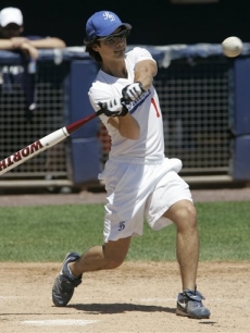 Joe Jonas takes a swing during a softball game with his Road Dogs team in New Jersey on July 15, 2009