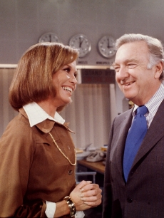 Mary Tyler Moore shares a smile with Walter Cronkite during the filming of the ‘Ted Baxter Meets Walter Cronkite’ episode of ‘The Mary Tyler Moore Show’ in Los Angeles on January 18, 1974