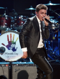 Jesse McCartney takes the stage during dress rehearsal for Mandela Day Celebration Concert at Radio City Music Hall in New York City on July 18, 2009