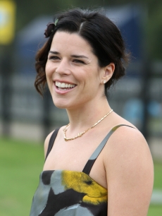 Neve Campbell shows her smile at the Cartier International Polo Day at Guards Polo Club in Egham, England on July 26, 2009