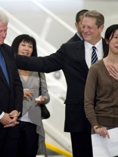 Journalist Laura Ling with former President Bill Clinton and former Vice President Al Gore at the Bob Hope Airport in Burbank, Calif., on Wednesday, August 5, 2009