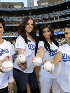 Kris Jenner and Kim, Kourtney and Khloe Kardashian strike a pose on the field during the LA Dodgers game on August 5, 2009
