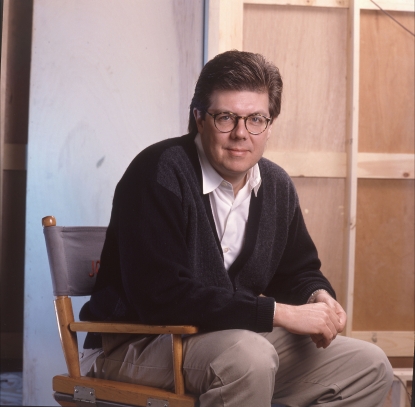 John Hughes in his director’s chair in 1990