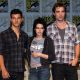 Taylor Lautner, Kristen Stewart and Robert Pattinson strike a pose during the 2009 Comic-Con ‘New Moon’ press conference in San Diego on July 23, 2009