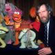 Film & televison director and puppeteer Jim Henson (1936 - 1990) poses with several of his Fraggle Rock muppets, 1983