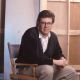 John Hughes in his director’s chair in 1990